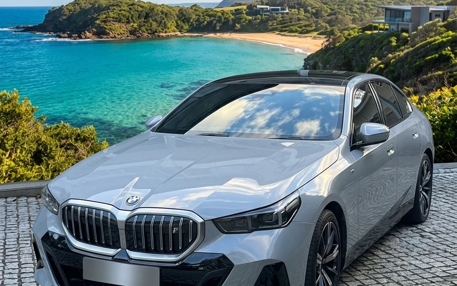 Executive chauffeur car by the coast for a Newcastle to Sydney transfer